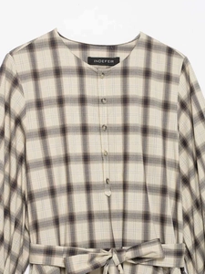 Detail showing the plaid pattern texture and waist belt on a round neck summer dress