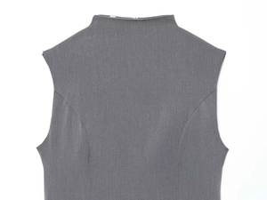 Detail of dark grey high-neck sleeveless dress with precise stitching and back zipper