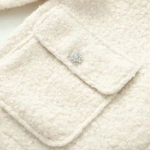 Elegant cream white tweed jacket with a sparkling crystal floral button on the pocket