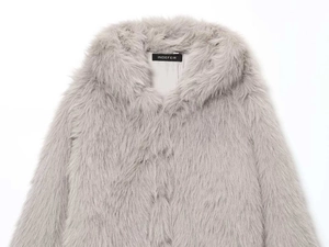 Close-up of light gray faux fur coat collar showing soft texture and inner brand label