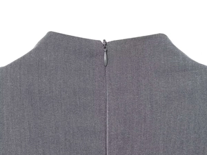 Detail of invisible back zipper closure on grey summer dress with fine fabric texture