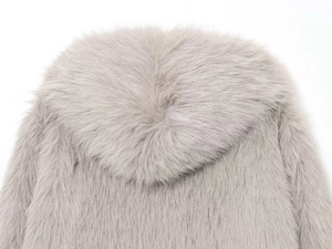 Detail of light grey faux fur hood showcasing soft long-hair texture and premium material