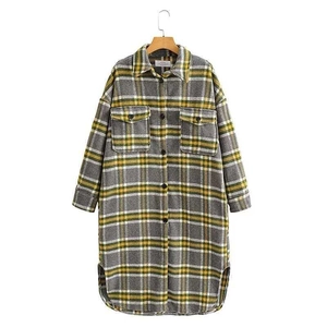 Plaid shacket with yellow, grey, and white checks featuring a lapel collar and flap pockets