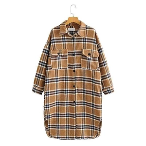 Brown vintage plaid flannel shirt jacket with large flap pockets and button-front design
