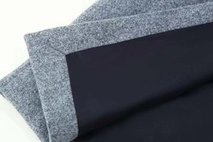 Detailansicht der hochwertigen grauen Wollmischung mit schwarzem Innenfutter