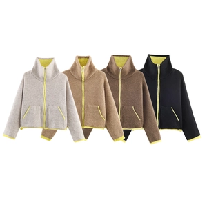 Detail of zip-up knit jackets in four colors featuring neon yellow contrast trim and high collar