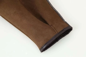 Close-up of winter jacket sleeve with dark brown faux suede and leather piping detail