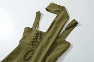 Detail of olive green halter dress featuring spaghetti straps and back lace-up closure