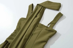 Detail of olive green halter dress with cross-wrap scarf design and matte fabric