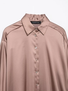 Detail of elegant satin shirt collar and button-down front in light dusty rose hue