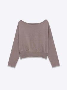 Close-up of boat neck knit sweater in dusty pink with ribbed hem and drop shoulder details