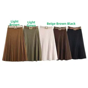 Detail of high waisted pleated midi skirts in five colors with matching square buckle belts