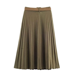 Detail of olive green pleated midi skirt featuring a fine brown belt with silver buckle