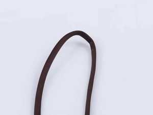 Detailed macro view of dark brown satin straps featuring fine woven texture and soft finish