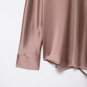 Elegant drop-shoulder satin shirt in smoky pink with smooth silk texture and drape