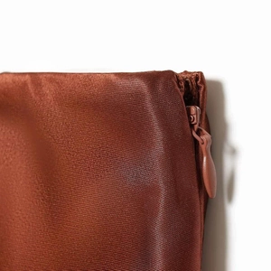 Brown satin skirt with delicate lace trim and matching invisible zipper detail