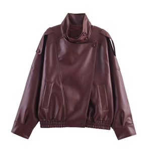 Detail of dark chestnut vintage leather jacket with epaulettes and textured lychee grain