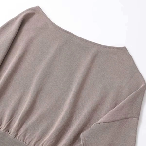 Elegant off-the-shoulder knit top for women with fine texture and ribbed hem detail