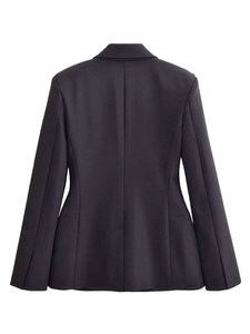 Rear view of a slim fit navy blazer featuring structured shoulders and a cinched waistline