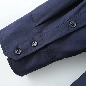 Detail of dark blue cotton poplin shirt cuff featuring a double-button closure design