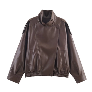Detail of vintage dark brown faux leather jacket featuring lychee texture and elastic hem