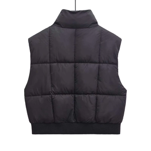 Women's black quilted puffer vest with stand collar and ribbed hem back view