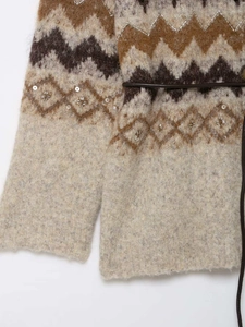 Detailed view of jacquard knit cardigan with shimmering sequins and beadwork accents