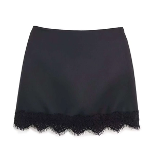 Women's black mini skirt featuring stylish eyelash lace hem on a clean white background
