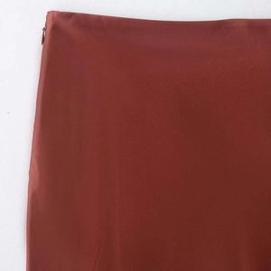 Red-brown satin midi skirt with side invisible zipper detail and smooth fabric texture