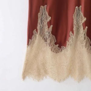 Deep reddish brown silk skirt with contrast white floral lace hem and eyelash detail