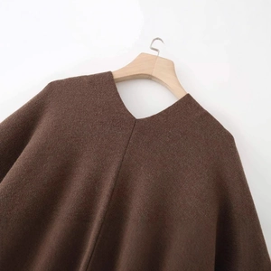Minimalist V-neck loose knit poncho style outerwear in deep brown wool blend