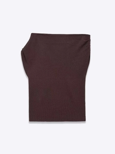 Detailed view of dark brown knitted ribbed fabric texture and fine stitching on the garment