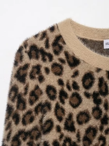 Close-up of leopard print knit sweater showing fluffy faux mohair texture and ribbed neckline
