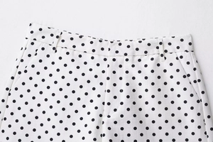 Detailed macro view of polka dot mini shorts with side pocket and cotton fabric texture