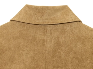 Detailed view of collar stitching on a brown suede jacket with premium texture