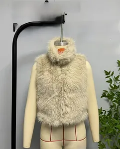 Close-up of beige faux fur vest with high neck collar and soft fluffy texture details