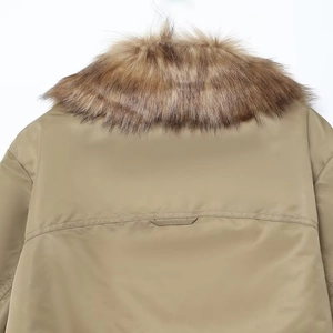 Close-up of fluffy faux fur collar and horizontal stitching on the khaki pilot jacket