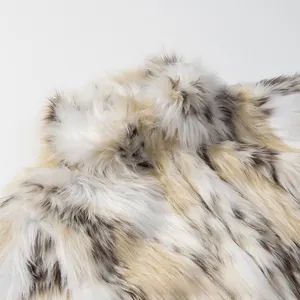 Detailed close-up showing soft artificial faux fur texture with elegant gradient stripes