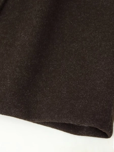 Macro shot showing the thick texture and soft fiber of dark brown wool blend fabric