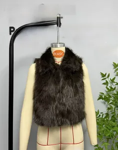 Detail of dark brown faux fur vest with soft plush texture and wide lapel on mannequin