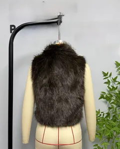 Close-up back view of a dark brown faux fur vest with dense long hair on a mannequin