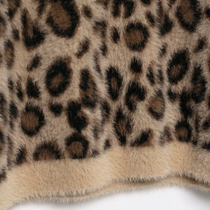 Leopard print faux fur knitwear with plush texture and warm khaki animal pattern