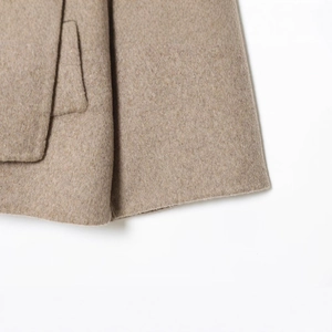Classic camel wool blend short coat with detailed stitching and soft textured fabric