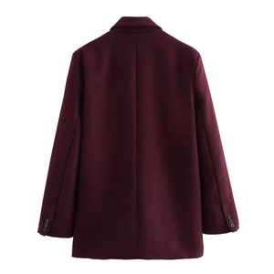 Rear view of a burgundy wool blend blazer featuring tailored seams and sleeve button details