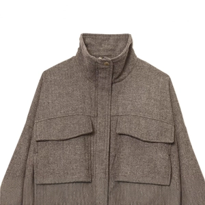 Brown herringbone bomber jacket with stand collar and large front flap pockets on white background