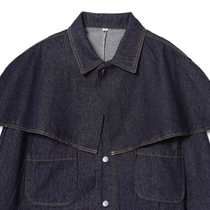 Deep blue denim jacket with unique cape collar structure and orange contrast stitching