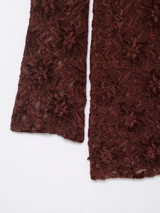 Close-up of dark red lace midi dress showing intricate floral embroidery and velvet texture