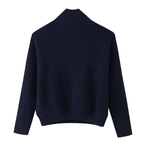 Detail view of navy blue ribbed knit texture and mock neck collar on autumn winter sweater