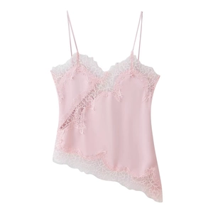 Detailed view of pink satin camisole top with floral lace trim and asymmetric hemline