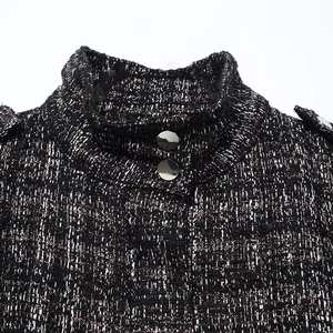 Detail of tweed bomber jacket with silver metallic buttons and structured shoulder tabs